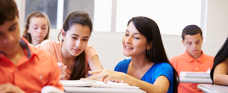 Teacher helping student